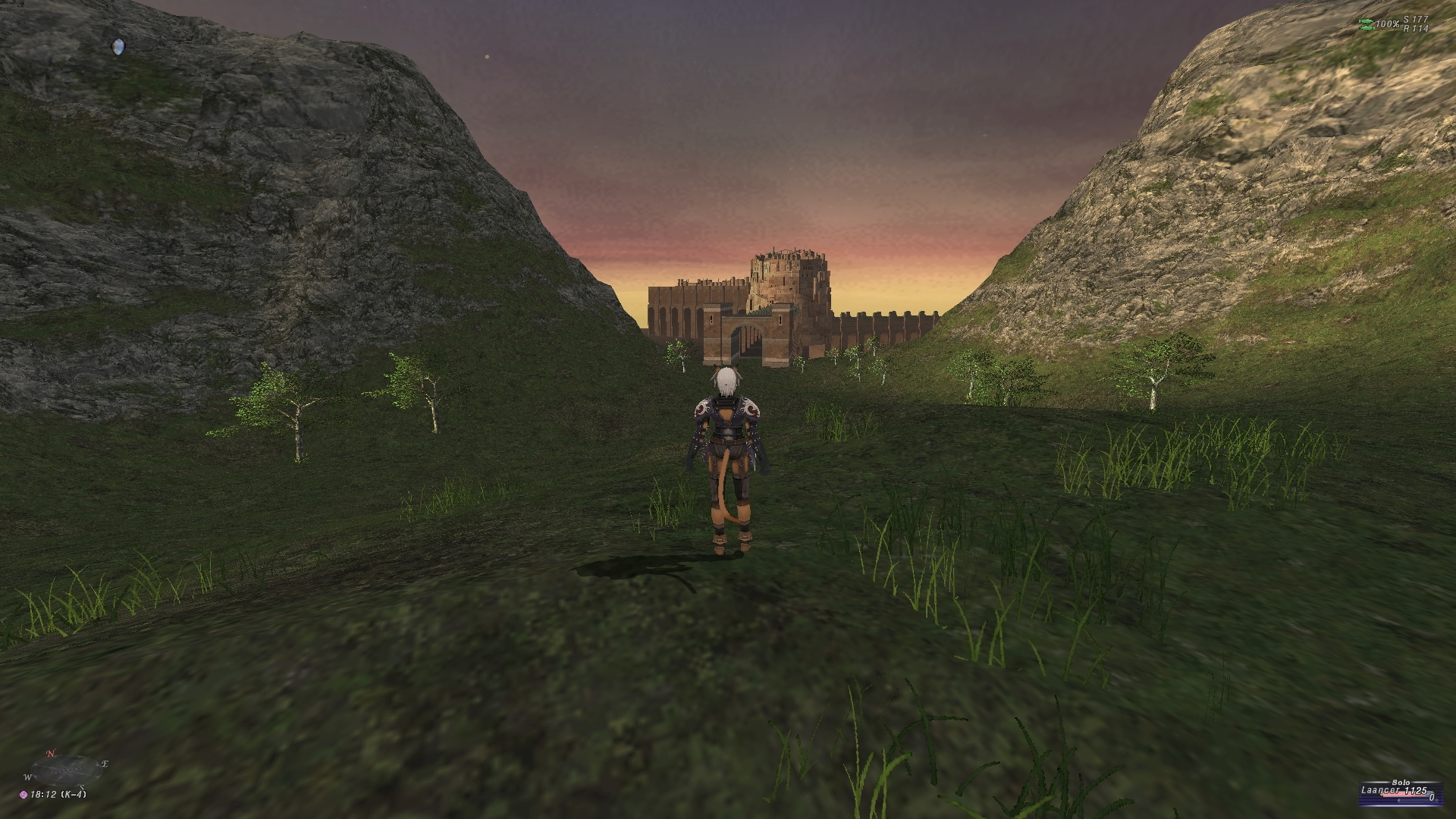 videogame avatar stands with back to camera in front of hills and castle in background.