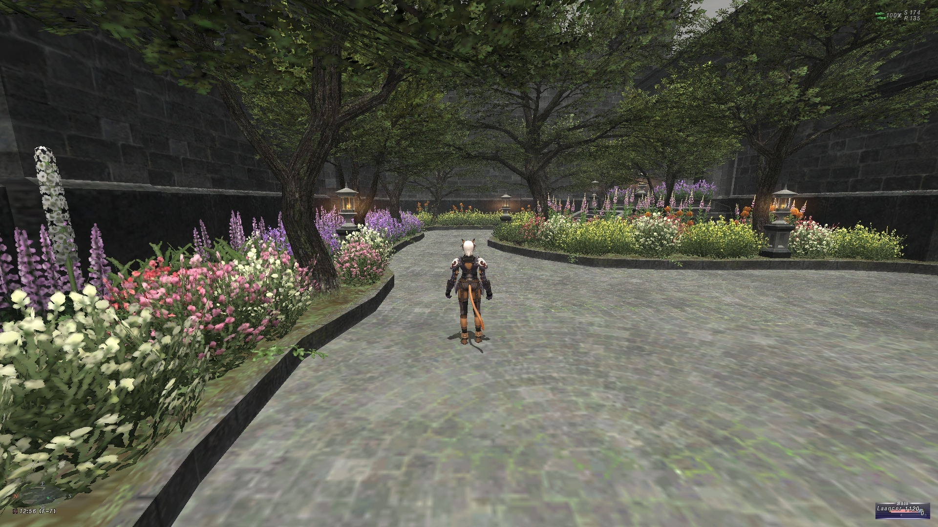 videogame avatar stands with back to camera in brick-floored garden.