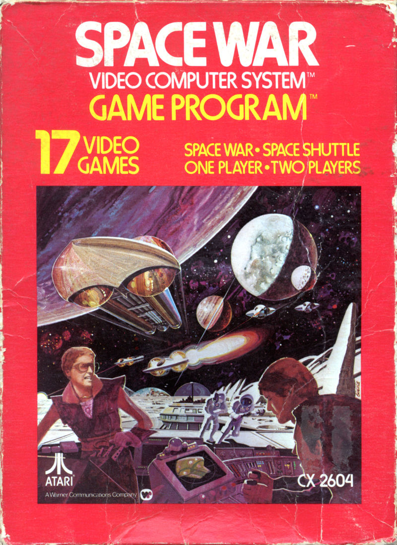 Bright red computer game packaging. Text reads: 'SPACE WAR, VIDEO COMPUTER SYSTEM, GAME PROGRAM; 17 VIDEO GAMES, SPACE WAR; SPACE SHUTTLE, ONE PLAYER, TWO PLAYERS.' Spaceships and planets lie in background, human at computer stations sit in foreground of cover image.